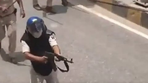 A police constable was suspended after a purported video showing him using an AK-47 rifle.
