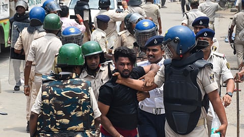 Police personnel resort to a lathi charge on students protesting during the Bihar bandh called by left-wing student organisations over the alleged NEET-UG paper leak at Exhibition Road in the Patna district of Bihar on Saturday, July 25, 2026.