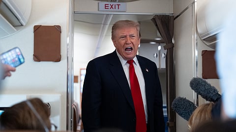 President Donald Trump speaks with reporters while on Air Force One en route to Oakland County International Airport, Monday, July 27, 2026, in Waterford Township, Mich.