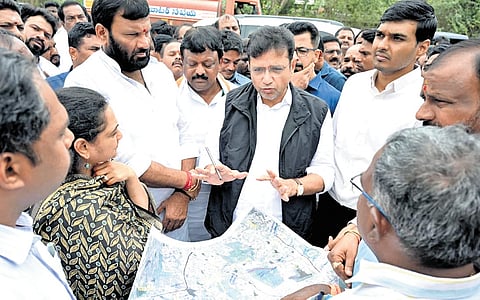 IT Minister D Sridhar Babu inspects the road-widening project at Dulapally on Monday