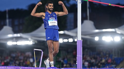 Sarvesh Kushare reacts after his jump on Monday