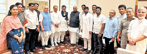 Chief Minister DK Shivakumar poses for shutterbugs with Congress MPs from Karnataka in New Delhi on Monday.