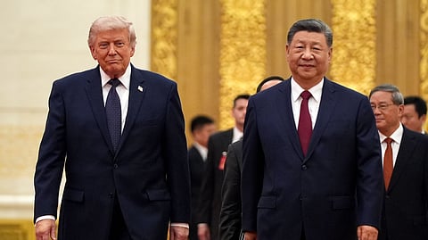 President Donald Trump, left, and Chinese President Xi Jinping arrive during a state dinner at the Great Hall of the People, May 14, 2026, in Beijing