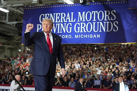 President Donald Trump gestures as he departs after speaking at General Motors proving ground, Monday, July 27, 2026, in Milford, Mich.