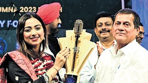 KIIT and KISS founder Achyuta Samanta felicitating Jyotirmayee on her achievement