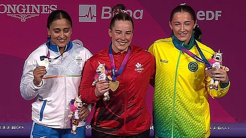 (L) Harjinder Kaur celebrates with the other two medallists