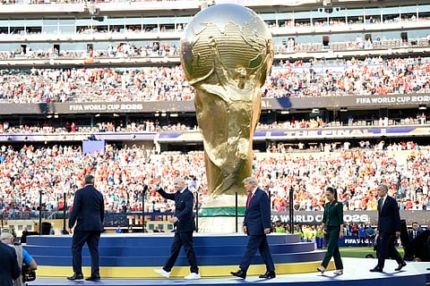 FIFA President Gianni Infantino waves when arriving with President Donald J. Trump, Mexico President Claudia Sheinbaum and Canada Prime Minister Mark Carney for the awards ceremony after the World Cup final soccer match between Spain and Argentina in East Rutherford, N.J., near New York, Sunday, July 19, 2026.