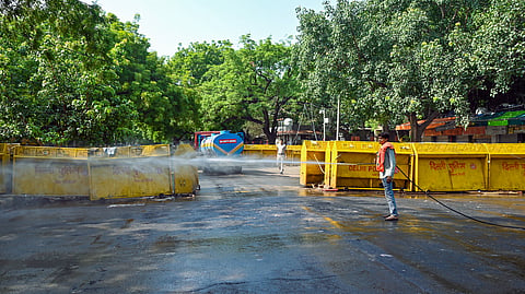 In this photo from July 26, 2026, NDMC workers clean the protest site at Jantar Mantar after the Cockroach Janta Party (CJP) called off its agitation.