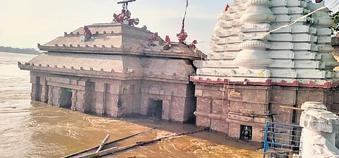 The Bhattarika temple in Badamba inundated with floodwater on Thursday | Express