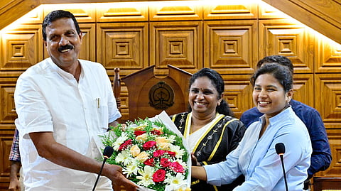 Ernakulam District Collector G Priyanka congratulates V R Sudheer, who won the corporation deputy mayor election. Mayor V K Minimol is also seen.