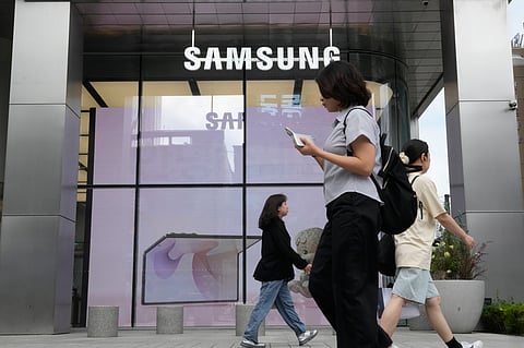 People pass by Samsung Gangnam store in Seoul, South Korea, Thursday, July 30, 2026.