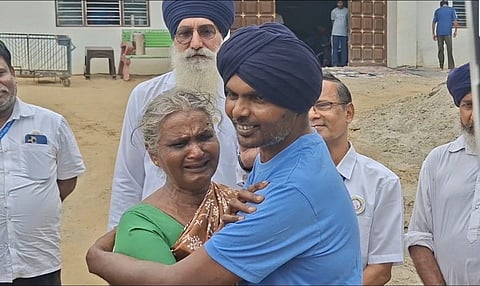 Overcome with emotion, Sundari hugged her son and bent down to touch his feet. "I feel very happy and it feels as though the god we worship has come home in the form of our son," she said before feeding Prakasam with her own hands.