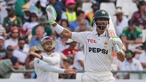 Pakistan's Shan Masood, foreground, gestures during the third day of the second test cricket match between South Africa and Pakistan, in Cape Town, South Africa, Sunday, Jan. 5, 2025.