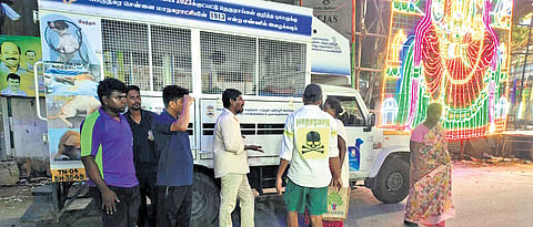 GCC staff interact with activists during dog-catching drive in Thiruvanmiyur