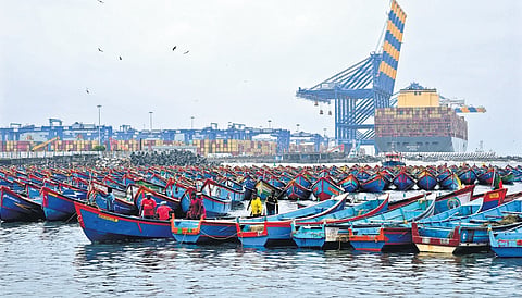 Hundreds of traditional fishing boats remain docked at Vizhinjam fishing harbour as fishermen suspended operations following adverse weather warning.