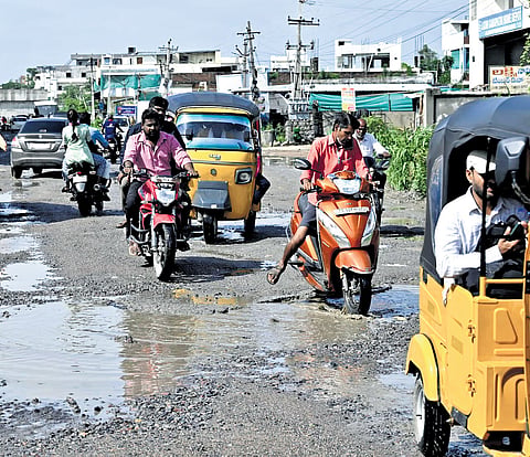 Commuters struggle on the pothole-ridden roads near Apollo Hospital in Karimnagar (above) and at Kondapur in Hyderabad | express,
Vinay Madapu