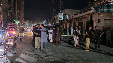 Police personnel cordon off a street following a suicide bombing during a protest in Pakistan's Swat district on August 2, 2026.