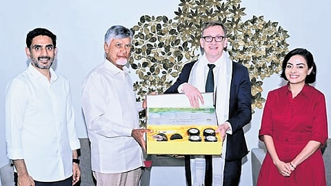 Chief Minister Nara Chandrababu Naidu felicitates Australian Minister Julian Hill at his camp office on Sunday | Express