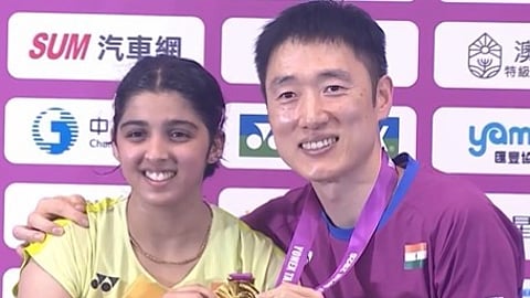 In a heartwarming moment, Tanvi took off her gold medal and placed it around coach Park Tae-sang's neck before the two posed together for photographs.