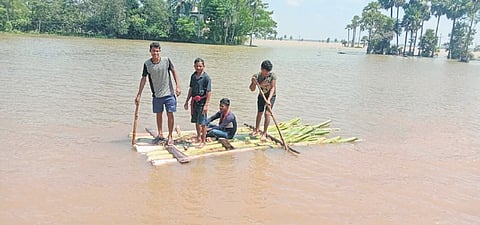 Flood-hit villagers using makeshift raft to reach safer locations in Aul block