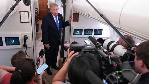 President Donald Trump speaks to reporters onboard Air Force One while returning to the White House, Sunday, Aug. 2, 2026.