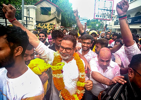 Jan Suraaj Party founder and candidate Prashant Kishor greets people during a victory march