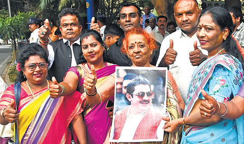 Supporters of Zameer Ahmed outside Lok Bhavan in Bengaluru on Monday
