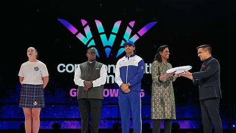 President of Commonwealth Sport Donald Rukare, second left passed the baton to Neeraj Chopra, PT Usha, President, Commonwealth Games Association of India, and then to Deputy Chief Minister of Gujarat, Harsh Sanghavi during the closing ceremony for Commonwealth Games in Glasgow, Scotland, Sunday, Aug. 2, 2026.
