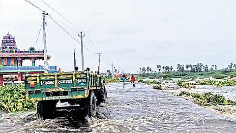 Floodwater flows over the bridge across the Musi between Bollepally and Sangem villages in Yadadri Bhuvanagiri district on Tuesday