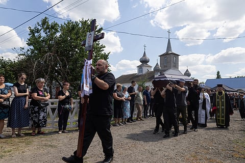 Pallbearers carry the coffin of a family member who was killed on July 30, 2026, during a funeral ceremony in Kryvyi Rig on August 3, 2026