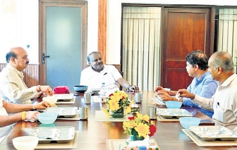 Senior BJP leaders Basavaraj Bommai, PC Mohan and R Ashoka discuss state poltiics with Union Minister and JDS leader HD Kumaraswamy in Delhi on Wednesday.