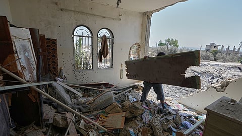 A Lebanese man removes debris from his destroyed house in the village of Zawtar al-Gharbieh, south Lebanon, Wednesday, Aug. 05, 2026.