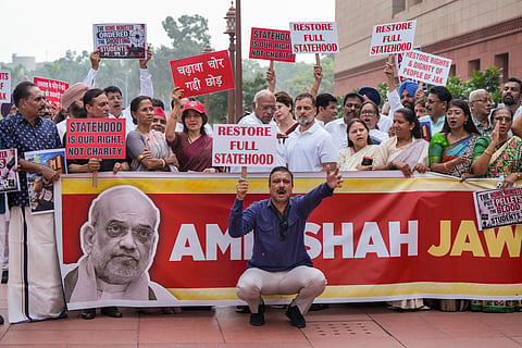 Leader of Opposition (LoP) in Lok Sabha Rahul Gandhi, Rajya Sabha LoP Mallikarjun Kharge, Samajwadi Party (SP) MP Dimple Yadav, NCP(SP) MP Supriya Sule, JMM MP Mahua Maji, TMC MP Saugata Roy and other opposition members stage a protest demanding Home Minister Amit Shah's statement on alleged police excesses against students.