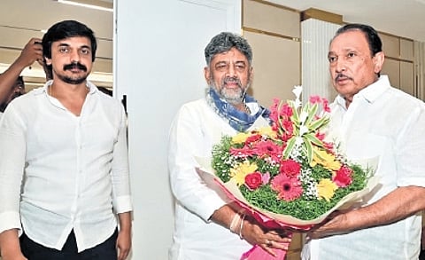 Chief Minister DK Shivakumar greets Congress MLA M Krishnappa in Bengaluru on Wednesday. MLA Priya Krishna is also seen