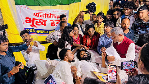 Leader of Opposition in the Jharkhand Legislative Assembly and BJP leader Babulal Marandi interacts with student leader Devendra Nath Mahato and other protesters staging an indefinite hunger strike against alleged paper leaks in the JSSC CGL examination and irregularities in JPSC exams, in Ranchi, Wednesday, Aug. 5, 2026.