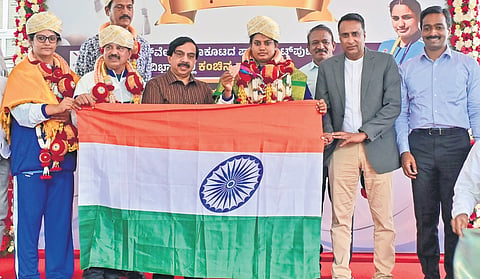 Parathlete K S Shilpa and her coaches being felicitated by MLC and Karnataka Olympic Association president K Govindaraju at Sree Kanteerava Stadium on Thursday.