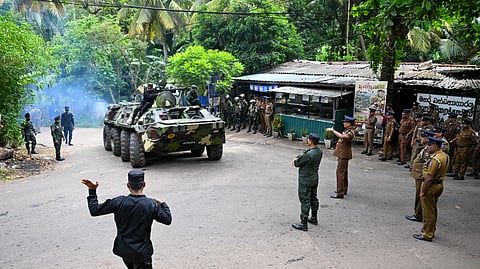Sri Lankan Army personnel patrol on a military tank outside the Mahara Prison complex on the outskirts of Colombo on August 2, 2026.