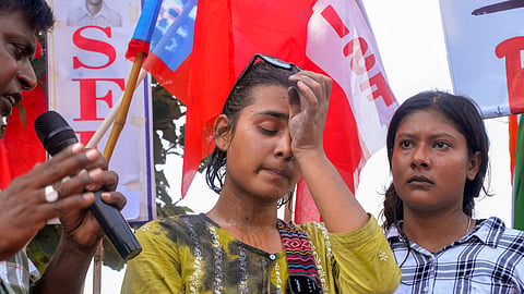 All India Student's Association (AISA) National President Neha Bora after a man threw ink on her during a protest against the alleged irregularities of examinations conducted by Jharkhand Public Service Commission (JPSC) and Jharkhand Staff Selection Commission (JSSC), in Ranchi, Friday, Aug. 7, 2026.