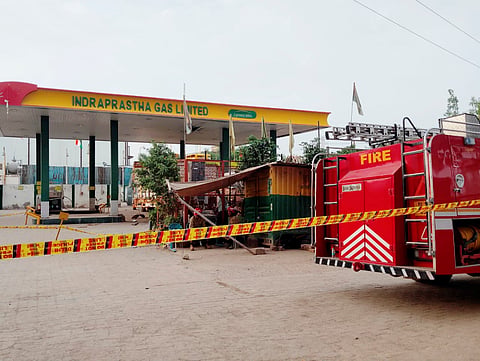 Police officials cordon off the site after the gas cylinder of a truck exploded while it was being refilled, at a CNG station in outer Delhi's Tikri Kalan, Wednesday, Aug. 19, 2026. Three people died and three were critically injured in the incident.