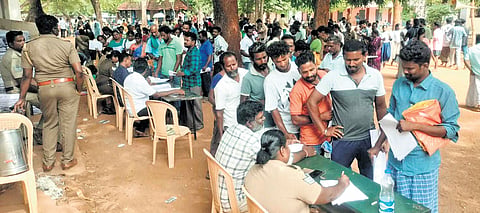 Victims filing complaints at a special camp in Madurai; (inset) complaints in bundles