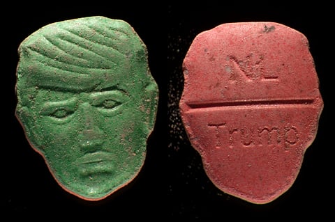 This undated photo provided by Trimbos Institute of Mental Health and Addiction shows pills that have a depiction of President Donald Trump on one side and on the other side NL and Trump stamped into the surface.