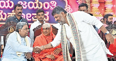 CM DK Shivakumar greets his predecessor Siddaramaiah at the inauguration of the 111th jayanti celebrations of Dr Sri Shivaratri Rajendra Mahaswamiji
