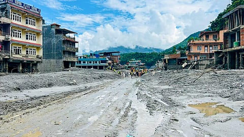 In Galchhi, about 50 km northwest of Kathmandu, residents are clearing mud and debris from their damaged homes.