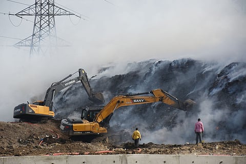 Firefighters battle a blaze at the Kodungaiyur dumpyard in Chennai on Sunday