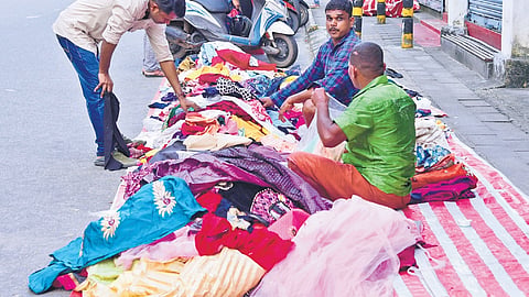 Unauthorised roadside vendors occupy parts of Broadway, causing inconvenience to pedestrians and affecting smooth traffic movement