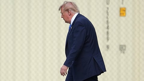 President Donald Trump walks to board his presidential limousine after arriving on Marine One from the Ellipse near the White House, Friday, Aug. 28, 2026, in Washington, on return from Houston.
