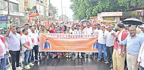 Members of the Oram community taking out the rally in Rourkela on Monday