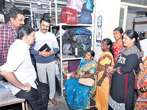 Transport Minister Byrathi Suresh listens to the grievances of passengers at Kempegowda Bus Station on Monday