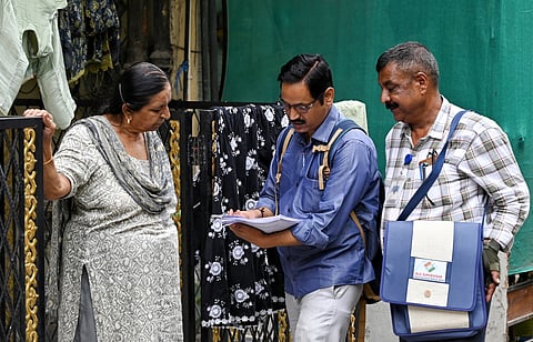 Booth Level Officers (BLOs) conduct a door-to-door Special Intensive Revision (SIR) of electoral rolls and a voter enumeration drive in New Delhi.