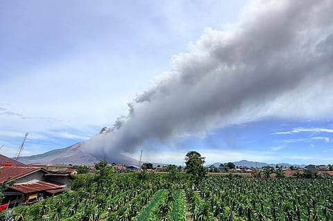 In this photo released by the Geological Agency (Badan Geologi) of Indonesia's Ministry of Energy and Mineral Resources, Mount Sinabung releases volcanic materials into the air during an eruption in Karo, North Sumatra, Indonesia, Monday, Aug. 31, 2026.